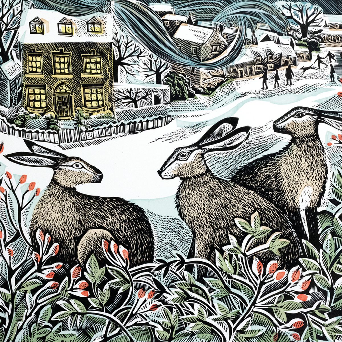 Christmas card design featuring an illustration by Angela Harding of three hares in a snowy scene in front of village houses