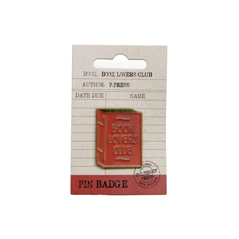 A red enamel book-shaped pin badge with 'BOOK LOVERS CLUB' embossed on the front, mounted on a cardboard backing card printed with book club details