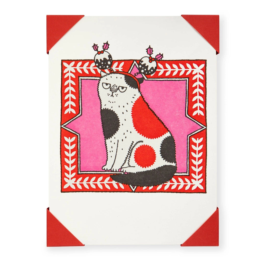 Card with a stylized cat design on a red and white background