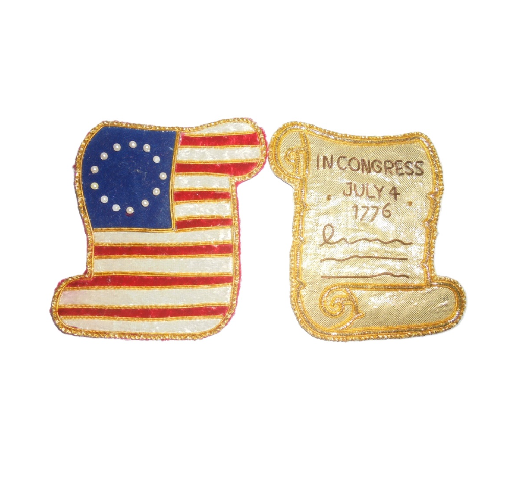 Embroidered decoration featuring first American flag on one side and Declaration on the reverse