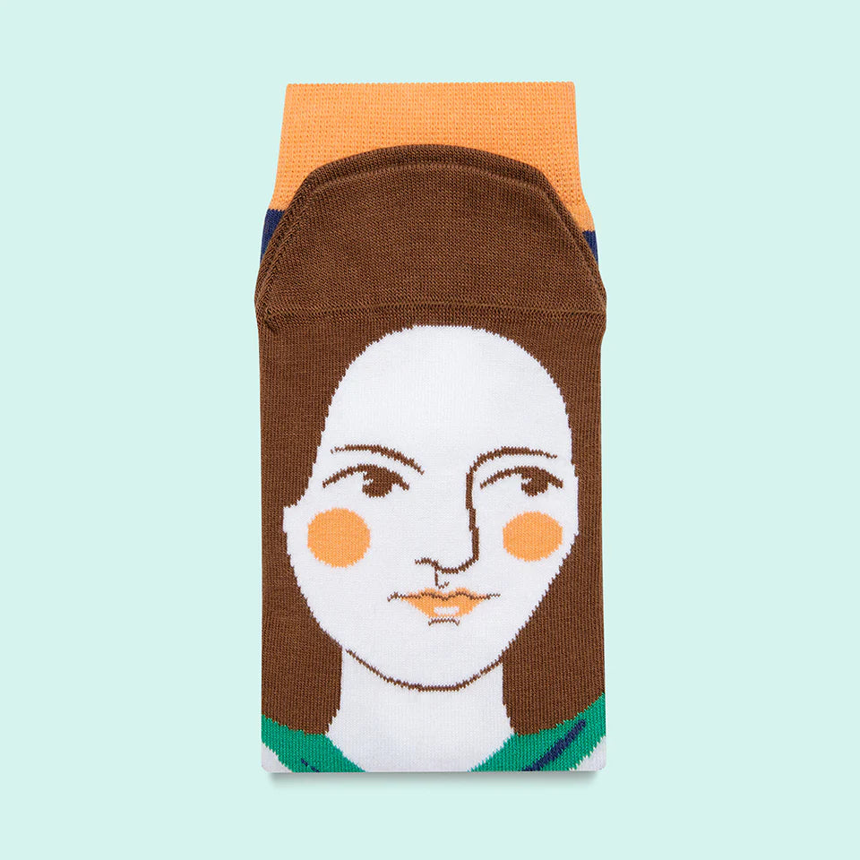 Sock with a design of a face on a light blue background