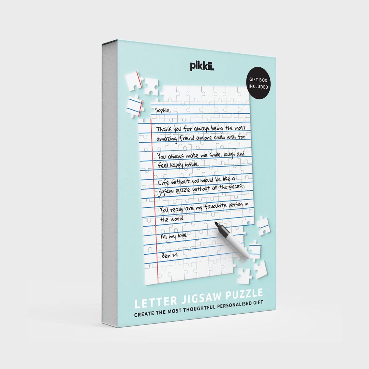 Letter jigsaw puzzle packaging with a pen on a light blue background