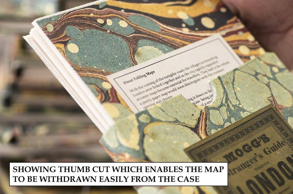 Picture showing thumb cut which enables the map to be withdrawn  easily from the case.