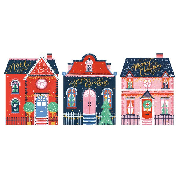 Three colorful Christmas-themed houses with decorative elements on a white background.